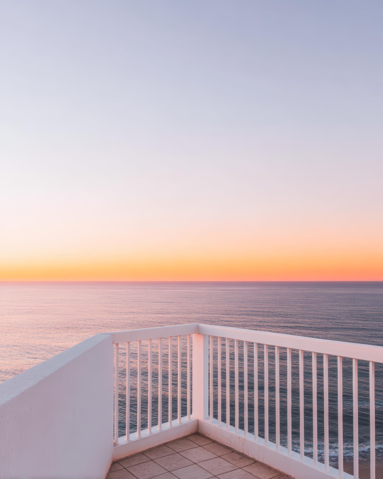 City-view balcony at sunset